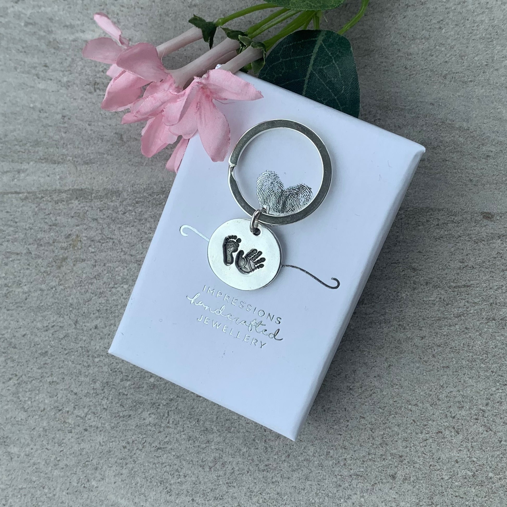 Circle Hand and Footprint Keyring with name and date of birth on reverse by Joy Impressions