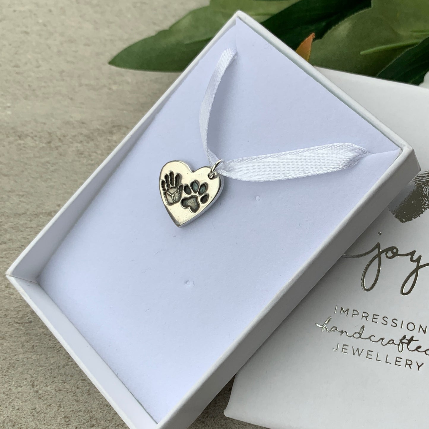 Handprint and Pawprint together on one heart charm with names on reverse by Joy Impressions